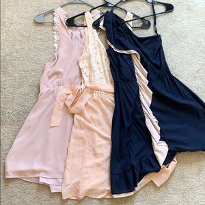 Three blue and pink bridesmaid dresses